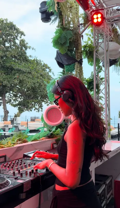 Amias DJing at an outdoor daytime set